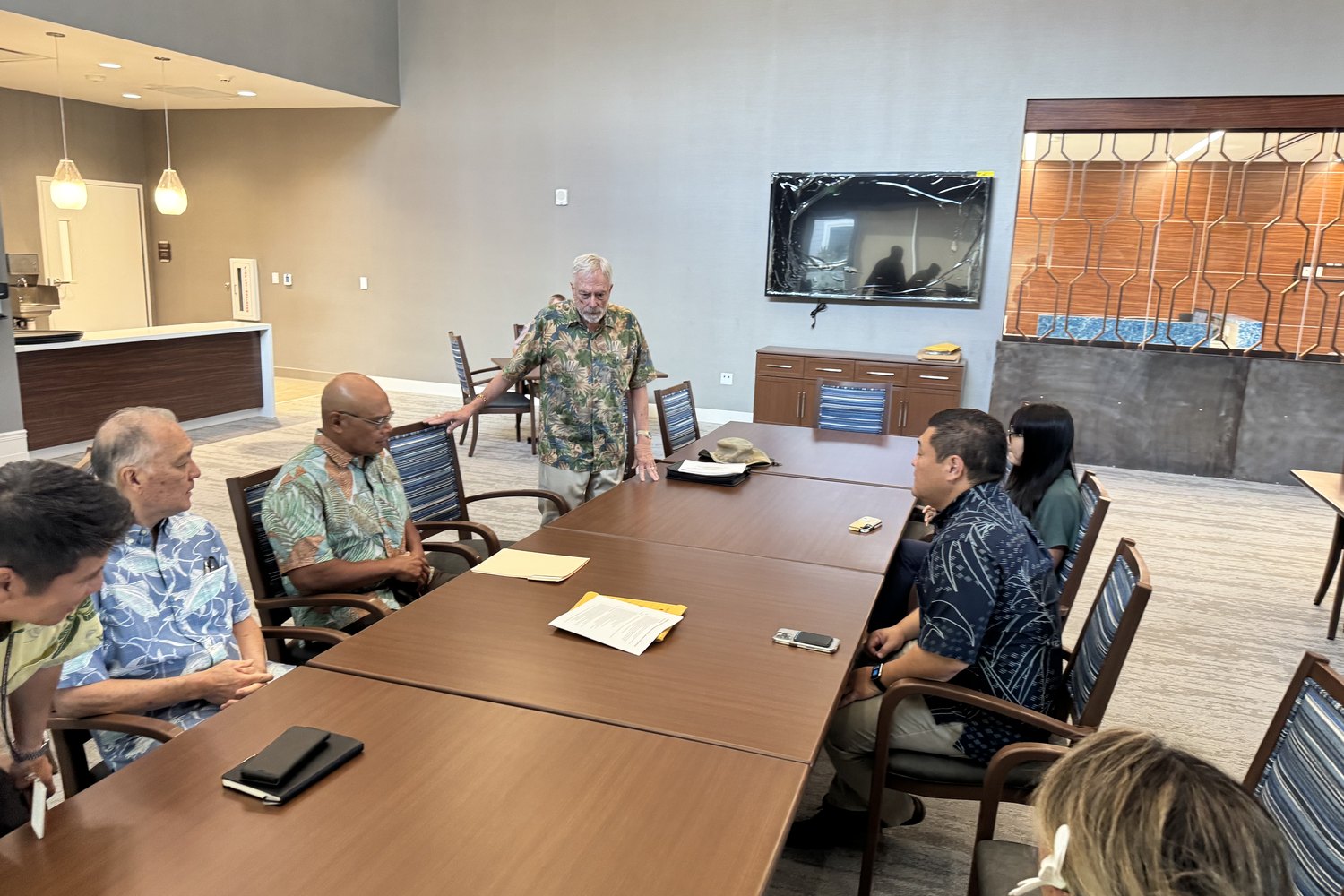 Tyson Miyake in a meeting with community and county leaders
