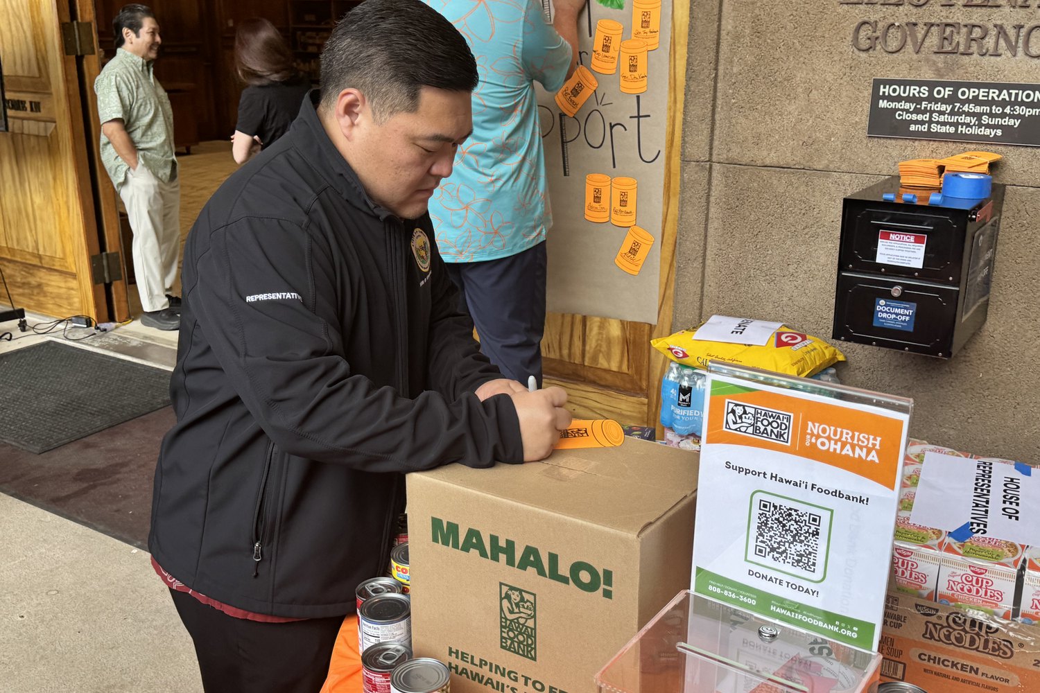 Tyson Miyake helping with a community service drop-off