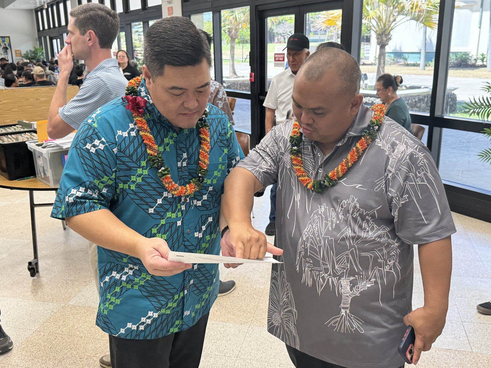 Tyson Miyake reviewing community housing plans
