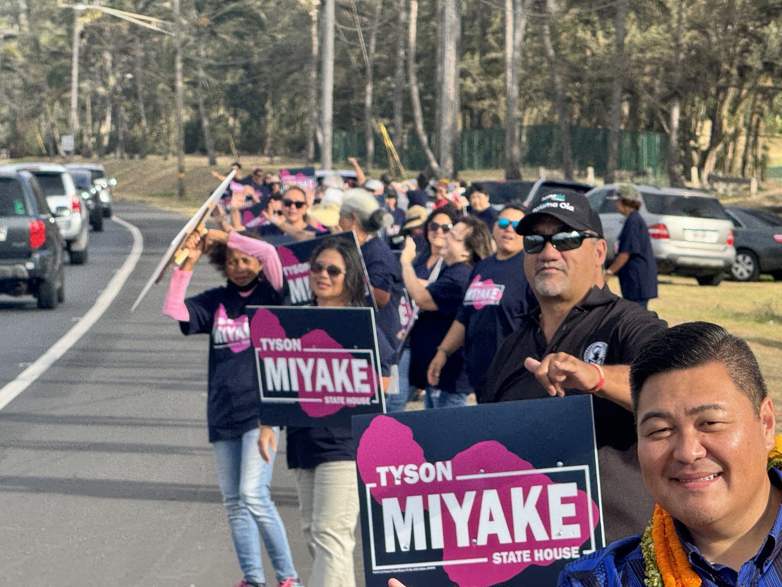 Tyson Miyake with community members at a campaign event